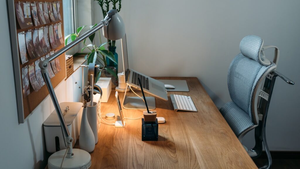 Cozy desk setup with warm lighting and organized workspace