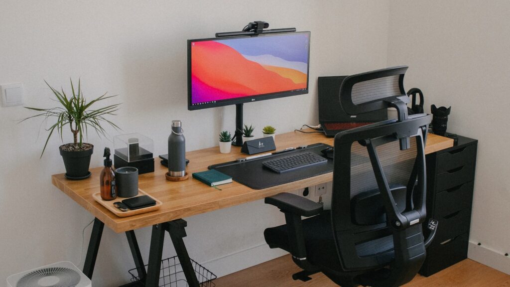 Ergonomic desk setup with chair monitor and keyboard