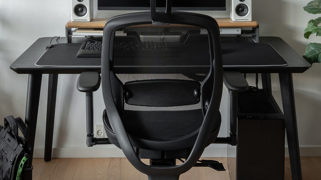 Ergonomic chair and desk setup for footrest and chair adjustment