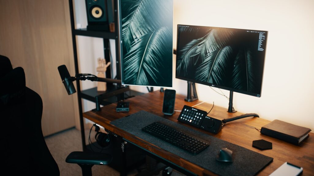 Small bedroom office desk setup with monitor and chair