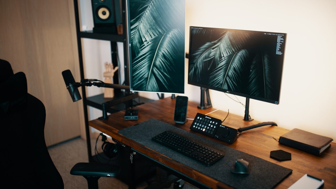 Small bedroom office desk setup with monitor and chair