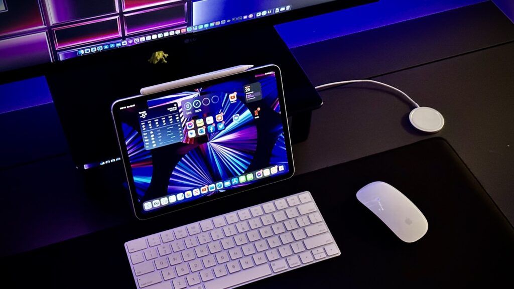 Keyboard and mouse on a wood desk for pointing device comparison
