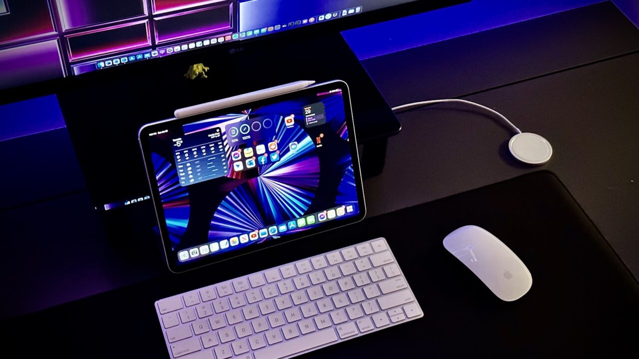 Keyboard and mouse on a wood desk for pointing device comparison